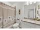 Clean bathroom with a single vanity, granite countertop and a tub shower combo at 14589 Ponce De Leon Trl, Port Charlotte, FL 33981