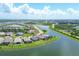 Aerial view of community with waterfront homes and lush landscaping at 14589 Ponce De Leon Trl, Port Charlotte, FL 33981