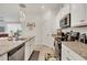 Modern kitchen with stainless steel appliances and granite counters at 14589 Ponce De Leon Trl, Port Charlotte, FL 33981