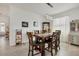 Bright dining room with wooden table and chairs near a window at 14589 Ponce De Leon Trl, Port Charlotte, FL 33981