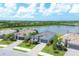 Aerial view of a waterfront community featuring new homes with modern architecture and landscaping at 14589 Ponce De Leon Trl, Port Charlotte, FL 33981
