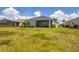 Single-Gathering home with covered patio and grassy backyard at 14589 Ponce De Leon Trl, Port Charlotte, FL 33981
