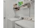 Functional laundry room with washer, dryer, and shelving for storage at 14589 Ponce De Leon Trl, Port Charlotte, FL 33981