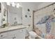 Charming bathroom with a single vanity, shower/tub combo, and a beachy theme at 14589 Ponce De Leon Trl, Port Charlotte, FL 33981