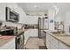 Modern kitchen with stainless steel appliances and granite counters at 14589 Ponce De Leon Trl, Port Charlotte, FL 33981