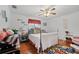 Guest bedroom with coastal decor and hardwood floors at 13703 Drysdale Ave, Port Charlotte, FL 33981