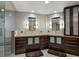 Contemporary bathroom with dual vanities, sleek cabinetry, and a glass-enclosed shower for a modern feel at 11000 Placida Rd # 2203, Placida, FL 33946