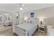 Serene bedroom with white furniture, a sailboat painting, and a mirrored closet, offering a tranquil retreat at 11000 Placida Rd # 2303, Placida, FL 33946