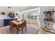 Charming dining area featuring a stylish blue cabinet, table set, and elegant décor at 11000 Placida Rd # 2303, Placida, FL 33946
