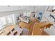Bright living room with hardwood floors, fireplace, and balcony access at 11000 Placida Rd # 2303, Placida, FL 33946