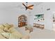 Cozy living room with vaulted ceiling, rattan furniture, and a ceiling fan at 11000 Placida Rd # 2303, Placida, FL 33946