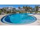 Community pool with steps and landscaping at 11000 Placida Rd # 2303, Placida, FL 33946