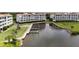 Aerial view of buildings surrounding dock and water at 11160 Hacienda Del Mar Blvd # D-205, Placida, FL 33946
