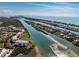 Expansive aerial shot capturing waterfront condos and homes nestled between winding waterways meeting the sea at 11160 Hacienda Del Mar Blvd # D-205, Placida, FL 33946