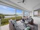 Relaxing screened balcony with comfortable seating and picturesque water views at 11160 Hacienda Del Mar Blvd # D-205, Placida, FL 33946