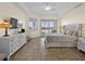 Spacious main bedroom with a waterfront view and direct access to the balcony at 11160 Hacienda Del Mar Blvd # D-205, Placida, FL 33946