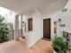 Inviting condo entrance features a private balcony, outdoor bench and mature tropical landscaping at 11160 Hacienda Del Mar Blvd # D-205, Placida, FL 33946