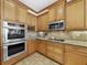 Gourmet kitchen featuring stainless steel appliances, granite countertops, and ample cabinet space at 11160 Hacienda Del Mar Blvd # D-205, Placida, FL 33946