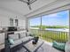 Screened lanai with beautiful water views, wet bar and seating at 11160 Hacienda Del Mar Blvd # D-205, Placida, FL 33946