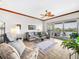 Comfortable living room with access to a private balcony overlooking the water at 11160 Hacienda Del Mar Blvd # D-205, Placida, FL 33946