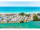 Aerial view of waterfront property with canal and beach access at 2375 N Beach Rd # 3B, Englewood, FL 34223