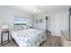 Primary bedroom with king bed and bathroom access at 2375 N Beach Rd # 3B, Englewood, FL 34223