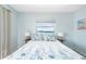 Primary bedroom with king-size bed and water views at 2375 N Beach Rd # 3B, Englewood, FL 34223