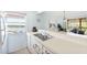 Kitchen with double sink, window overlooking water views at 2375 N Beach Rd # 3B, Englewood, FL 34223