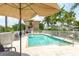 Relaxing community pool with patio furniture at 2375 N Beach Rd # 3B, Englewood, FL 34223