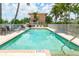 Refreshing pool with lounge chairs and building view at 2375 N Beach Rd # 3B, Englewood, FL 34223