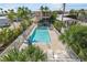 Community pool with surrounding patio furniture at 2375 N Beach Rd # 3B, Englewood, FL 34223