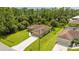 Aerial view showing a single-Gathering home with a driveway and surrounding landscape at 3288 Myrica St, North Port, FL 34286