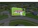 An aerial view showing a well-maintained lawn, patio area, and landscaping at 6367 Facet Ln, Port Charlotte, FL 33981