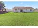 Backyard with a well-maintained lawn and an outdoor gazebo at 6367 Facet Ln, Port Charlotte, FL 33981