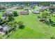 Expansive backyard featuring a pool, lush lawn, and space for recreation at 6367 Facet Ln, Port Charlotte, FL 33981