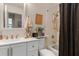 Bathroom featuring a white sink vanity and shower-tub combination at 6367 Facet Ln, Port Charlotte, FL 33981