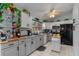 Well-lit kitchen with sleek countertops, modern appliances, and ample cabinet space for storage at 6367 Facet Ln, Port Charlotte, FL 33981