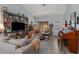 Spacious living room with a cozy atmosphere, hardwood floors, and ample seating options at 6367 Facet Ln, Port Charlotte, FL 33981