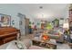 Inviting living room featuring a high ceiling, sliding barn doors, and neutral tones at 6367 Facet Ln, Port Charlotte, FL 33981