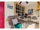 Inviting covered porch with comfortable wicker seating and decorative accents. Perfect for relaxing at 6367 Facet Ln, Port Charlotte, FL 33981