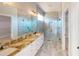 Beautiful bathroom featuring a spacious shower, granite countertops, and double vanity sinks at 721 Redbud Ct, Englewood, FL 34223
