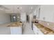 Bright kitchen with a large center island, stainless steel appliances, and plenty of storage space at 721 Redbud Ct, Englewood, FL 34223