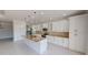 Contemporary kitchen featuring white cabinetry, granite countertops, pendant lighting, and stainless steel appliances at 721 Redbud Ct, Englewood, FL 34223