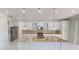 Beautiful kitchen with a central island, granite countertops, stainless steel appliances, and custom cabinetry at 721 Redbud Ct, Englewood, FL 34223