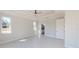 Spacious main bedroom featuring dual windows for natural light and a bathroom entrance at 721 Redbud Ct, Englewood, FL 34223