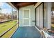 Spacious balcony with a view of well-maintained lawns, trees, and sliding glass doors at 8 Quails Run Blvd # 10, Englewood, FL 34223