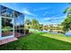 Private screened porch with backyard access at 3413 Pennyroyal Rd, Port Charlotte, FL 33953