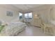 Cozy bedroom with floral bedding and a dresser at 3413 Pennyroyal Rd, Port Charlotte, FL 33953
