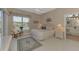 Spacious Primary bedroom with tiled floors and ensuite bathroom access at 3413 Pennyroyal Rd, Port Charlotte, FL 33953