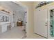 Entryway with view into home office and stained glass at 3413 Pennyroyal Rd, Port Charlotte, FL 33953